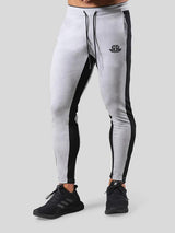 Man wearing ANVTT heather grey side stripe tapered jogger pants