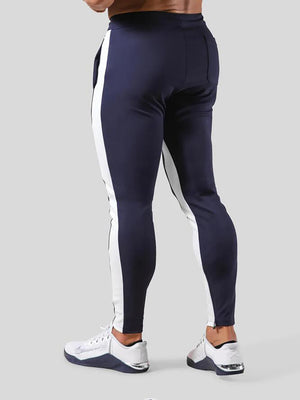 Man wearing ANVTT heather grey side stripe tapered jogger pants
