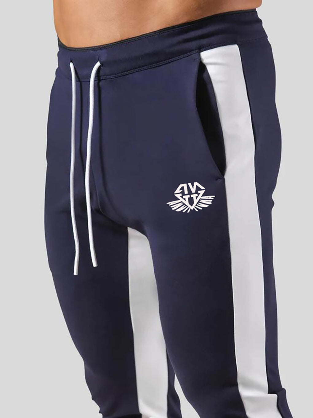Man wearing ANVTT heather grey side stripe tapered jogger pants